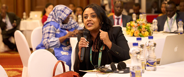 Speaker presenting at an event.