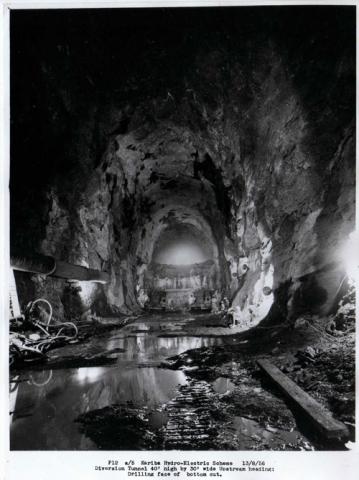 Diversion tunnel 40 foot high by 30 foot wide upstream heading drilling face of bottom cut